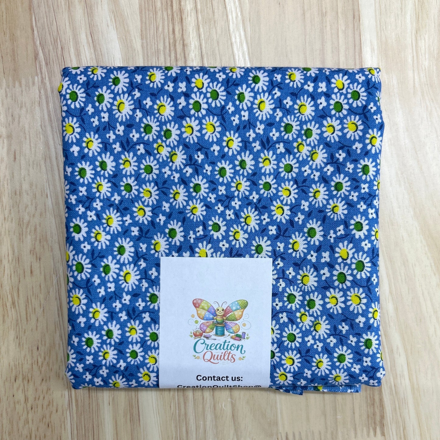 Blue with yellow & green daisies