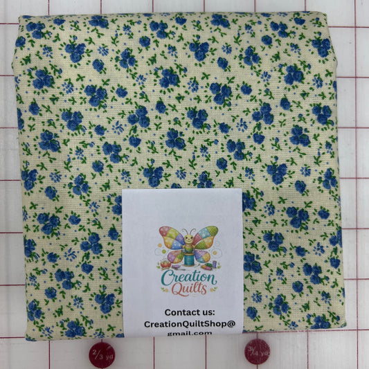 Cream with small blue flowers