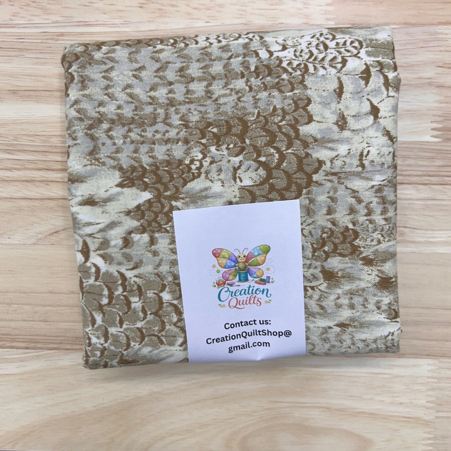 JoAnn Calico tan feathers